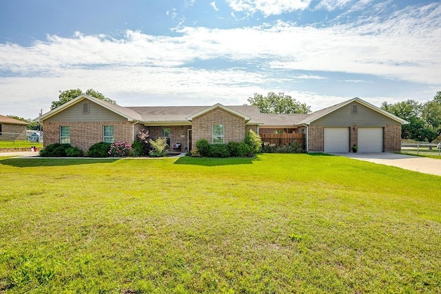 ranch-style home with a front yard and a garage