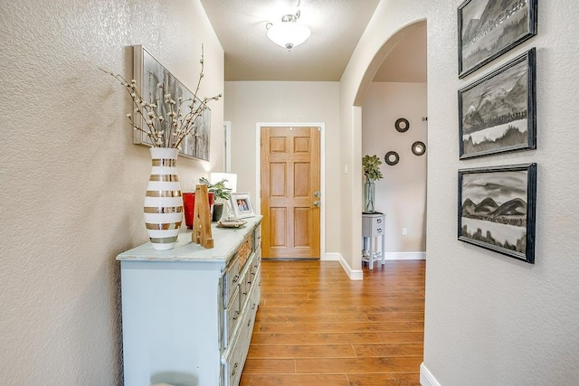 hall with light hardwood / wood-style floors