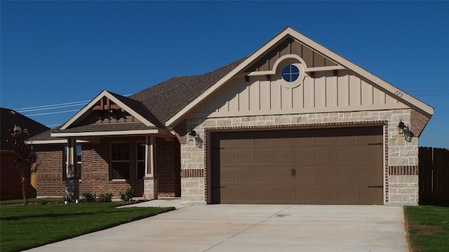 view of front facade featuring a garage and a front lawn