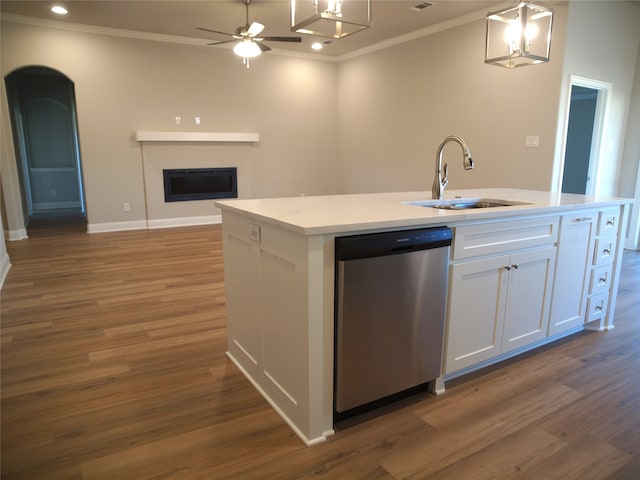 kitchen with white cabinets, stainless steel dishwasher, a center island with sink, decorative light fixtures, and dark hardwood / wood-style floors