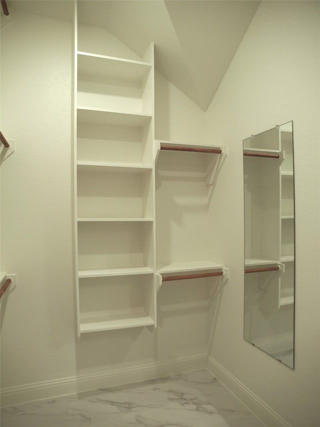 spacious closet featuring lofted ceiling