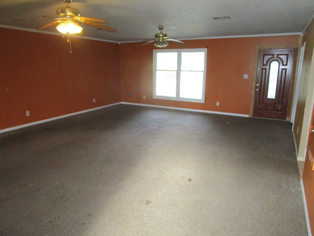 interior space featuring carpet, ceiling fan, and crown molding