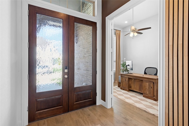 entrance foyer featuring light hardwood / wood-style flooring, french doors, and ceiling fan