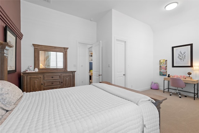 bedroom featuring light colored carpet