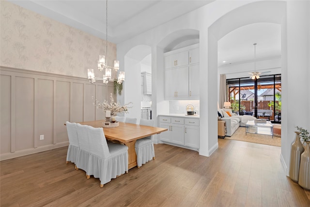 dining room with an inviting chandelier and light wood-type flooring