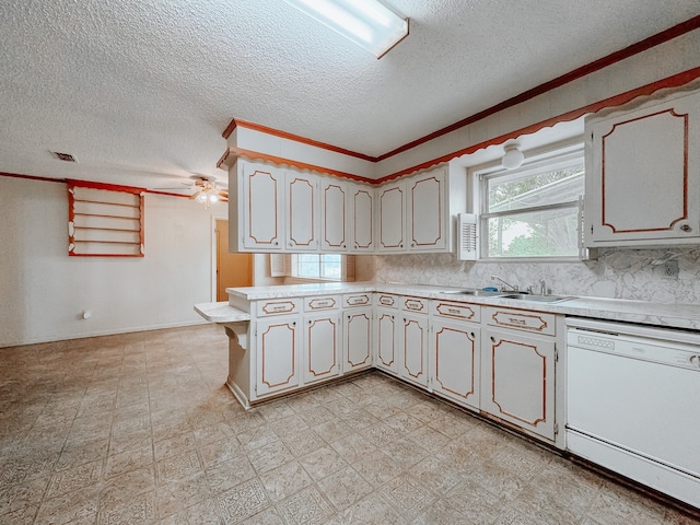 kitchen featuring ceiling fan, white dishwasher, crown molding, and sink