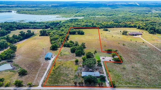 birds eye view of property with a rural view and a water view