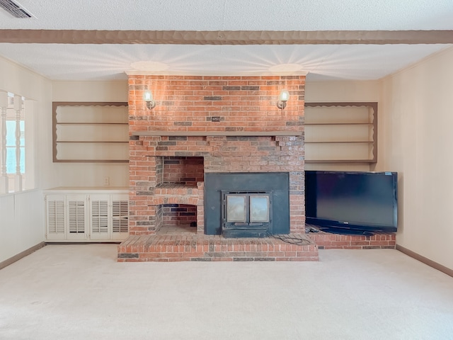 unfurnished living room featuring a brick fireplace, built in features, and carpet flooring