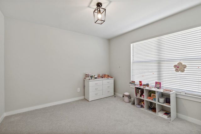 recreation room with light carpet