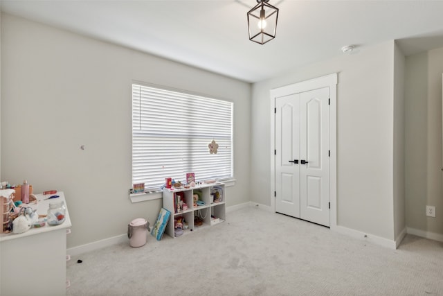 game room featuring light colored carpet