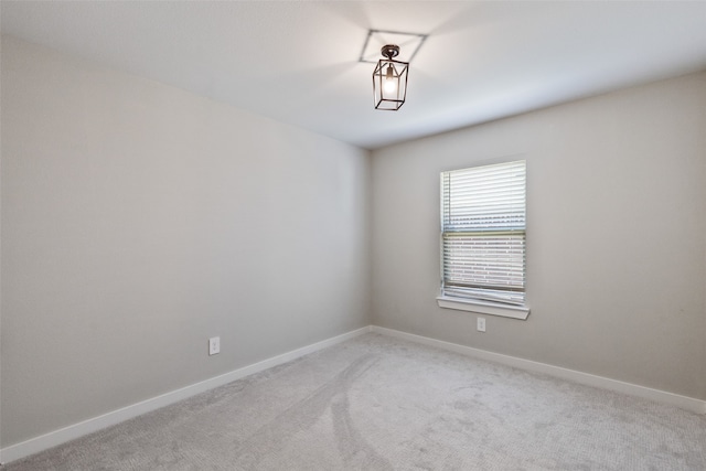 spare room with light colored carpet