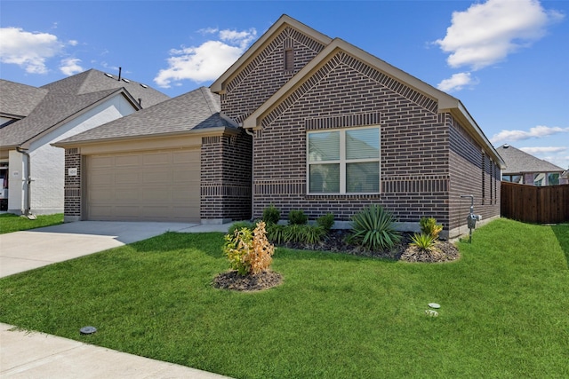 view of front of home featuring a front yard and a garage