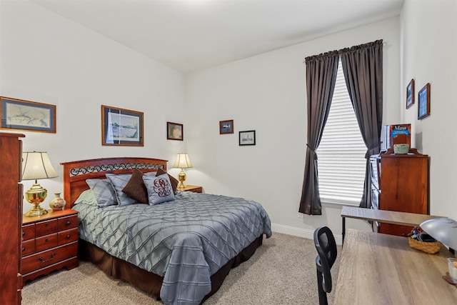 bedroom featuring light colored carpet