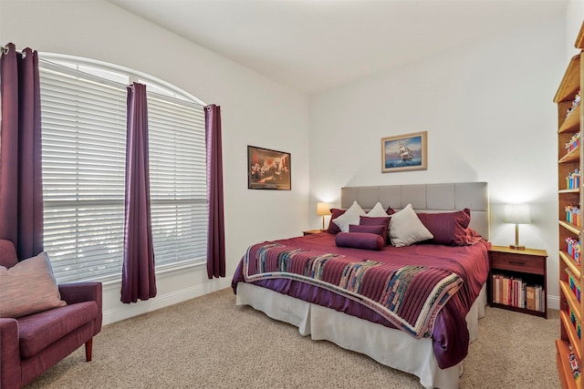 bedroom featuring light colored carpet