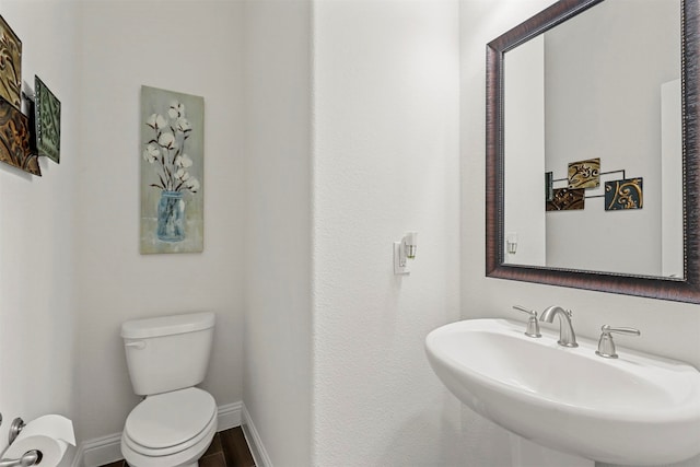 bathroom featuring sink and toilet