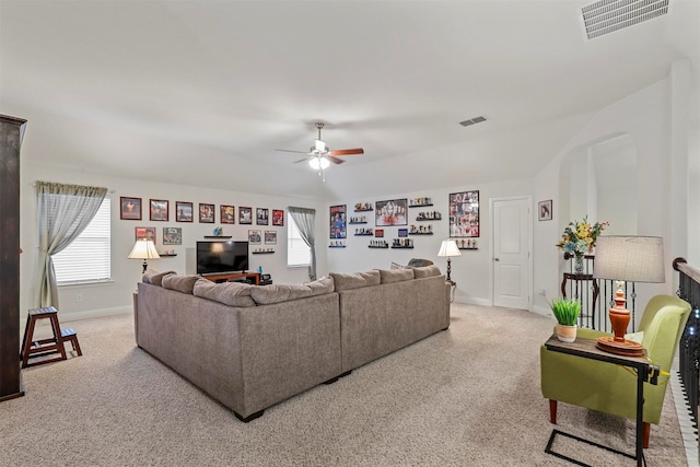 carpeted living room featuring ceiling fan and a healthy amount of sunlight