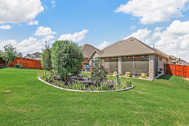 view of yard featuring a sunroom