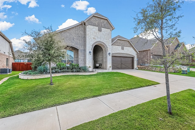 french country home with central AC unit and a front lawn