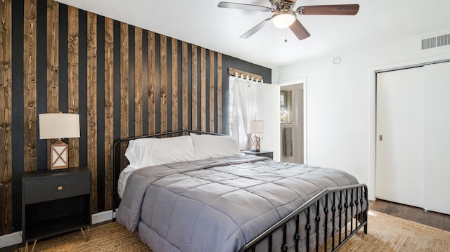 bedroom featuring a closet, ceiling fan, and hardwood / wood-style flooring