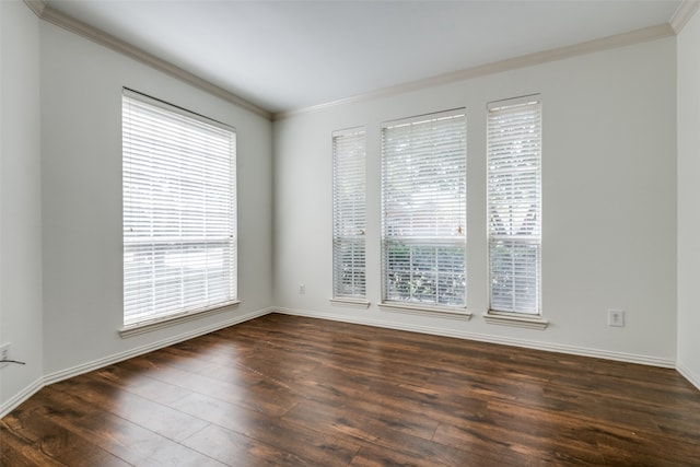 empty room with crown molding and dark hardwood / wood-style floors