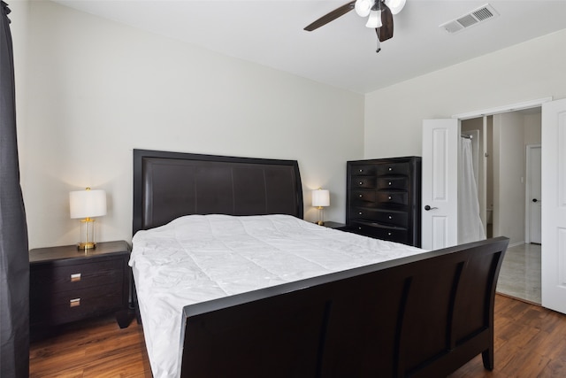 bedroom with ceiling fan and dark wood-type flooring