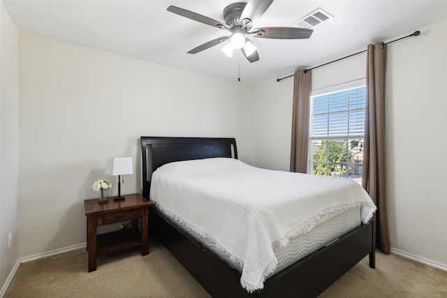 carpeted bedroom with ceiling fan