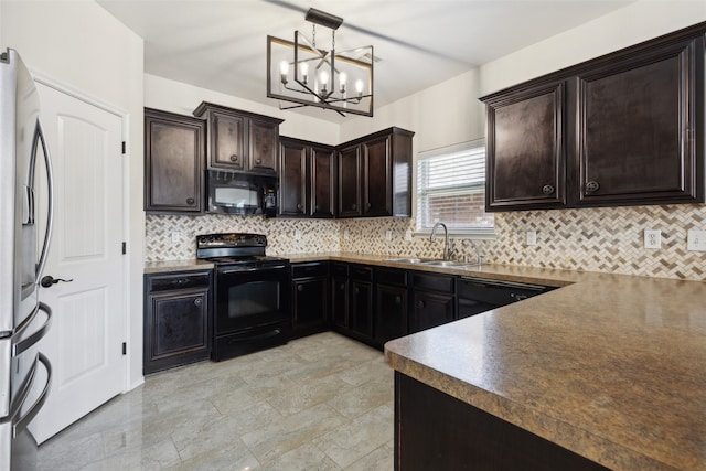 kitchen featuring hanging light fixtures, decorative backsplash, black appliances, an inviting chandelier, and sink