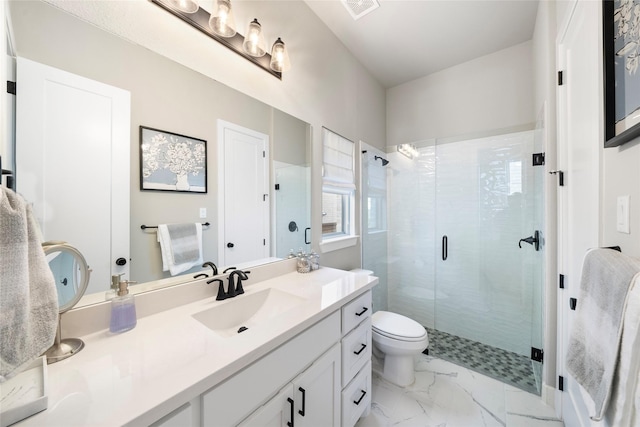 bathroom with a shower with door, vanity, and toilet