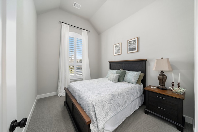 bedroom featuring vaulted ceiling and light carpet