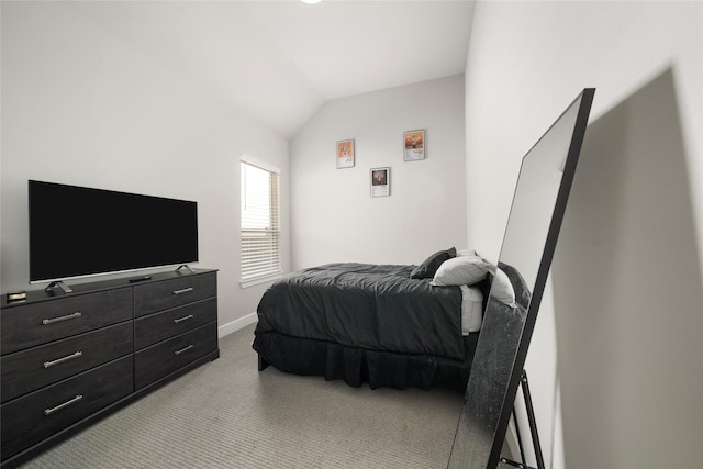 bedroom with light carpet and vaulted ceiling