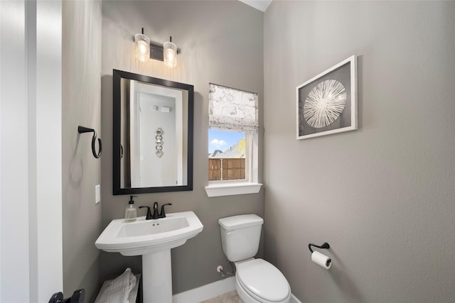 bathroom featuring sink and toilet