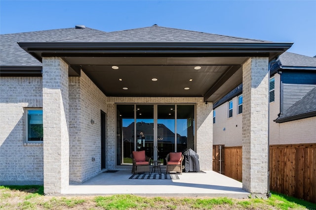 back of property featuring a patio area