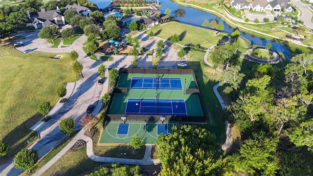 birds eye view of property with a water view