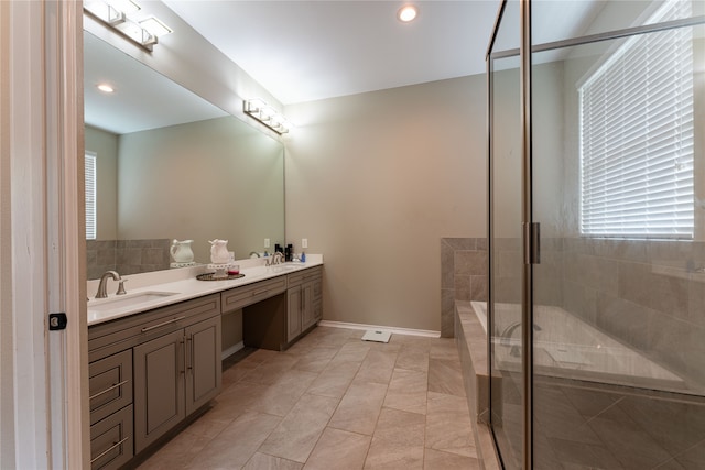 bathroom featuring vanity, a shower with door, and tile patterned floors