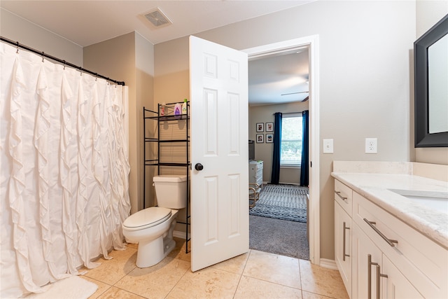 bathroom with tile patterned floors, vanity, and toilet