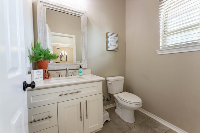 bathroom featuring vanity, toilet, and tile patterned floors