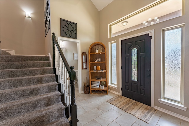 tiled entrance foyer with lofted ceiling