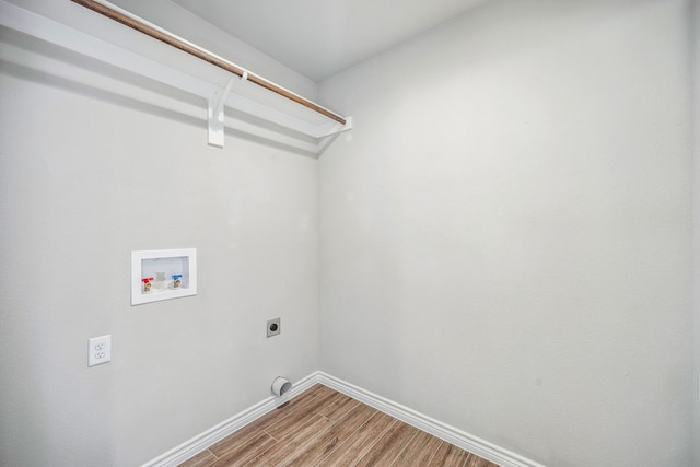 washroom featuring wood-type flooring, hookup for an electric dryer, and washer hookup