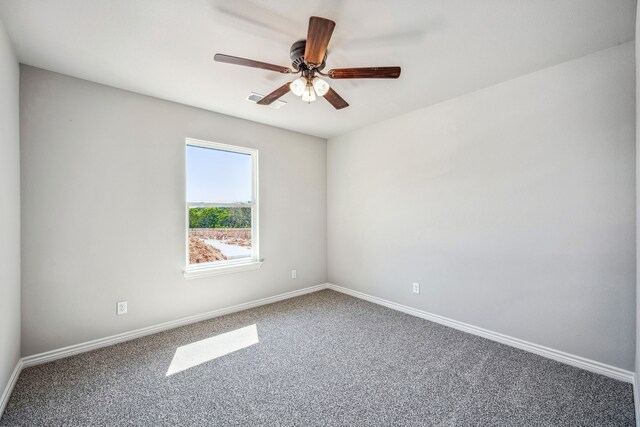 unfurnished room with ceiling fan and carpet flooring