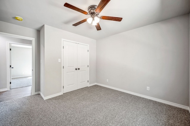 unfurnished bedroom with ceiling fan, carpet floors, and a closet