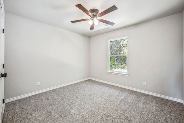 carpeted empty room featuring ceiling fan