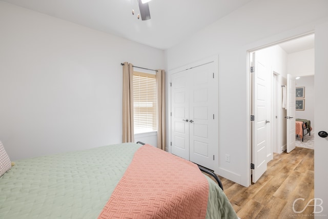 bedroom featuring light wood-type flooring and ceiling fan