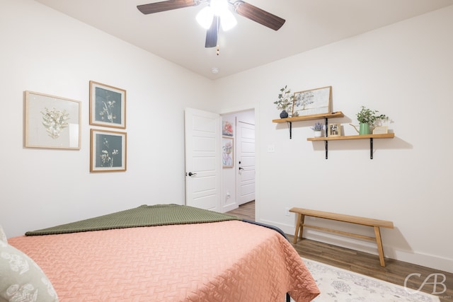 bedroom with ceiling fan and hardwood / wood-style floors