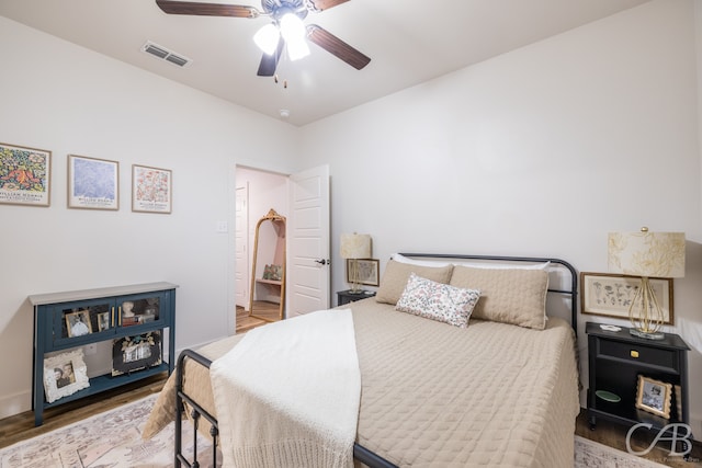 bedroom featuring wood-type flooring and ceiling fan