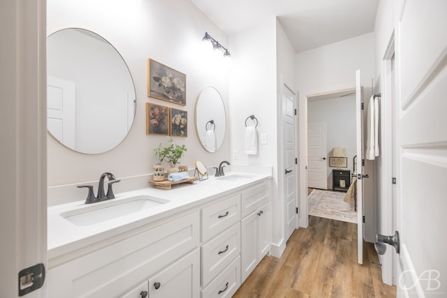 bathroom featuring hardwood / wood-style floors and vanity