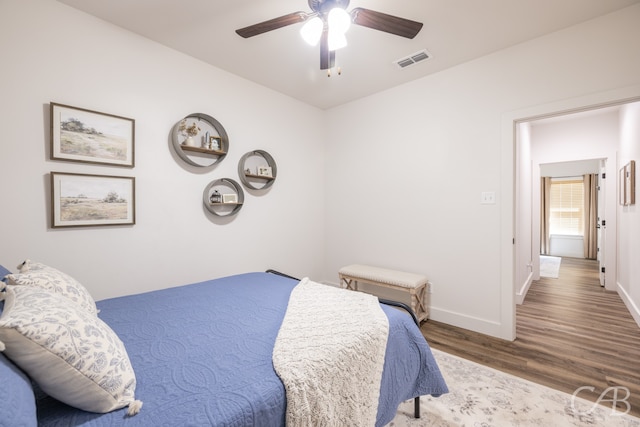 bedroom featuring wood-type flooring and ceiling fan