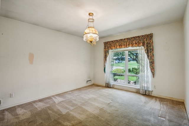 unfurnished room featuring carpet floors and a chandelier