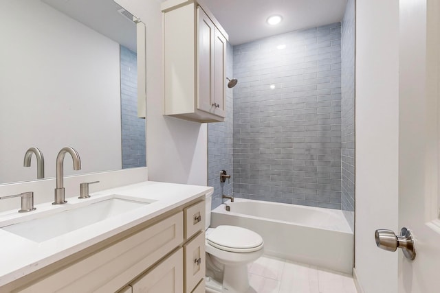 full bathroom featuring tile patterned floors, vanity, toilet, and tiled shower / bath