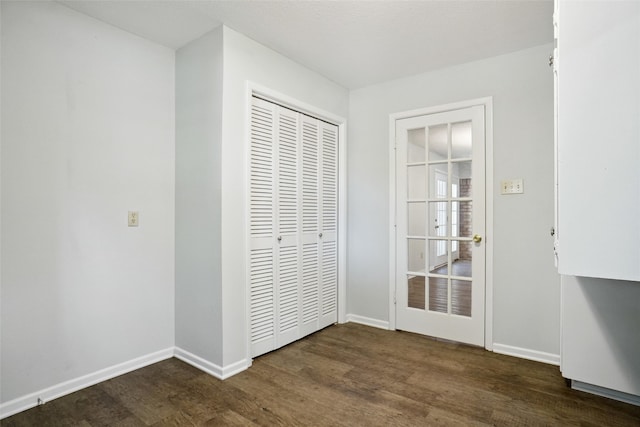 doorway featuring dark hardwood / wood-style flooring