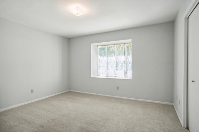 empty room featuring light carpet